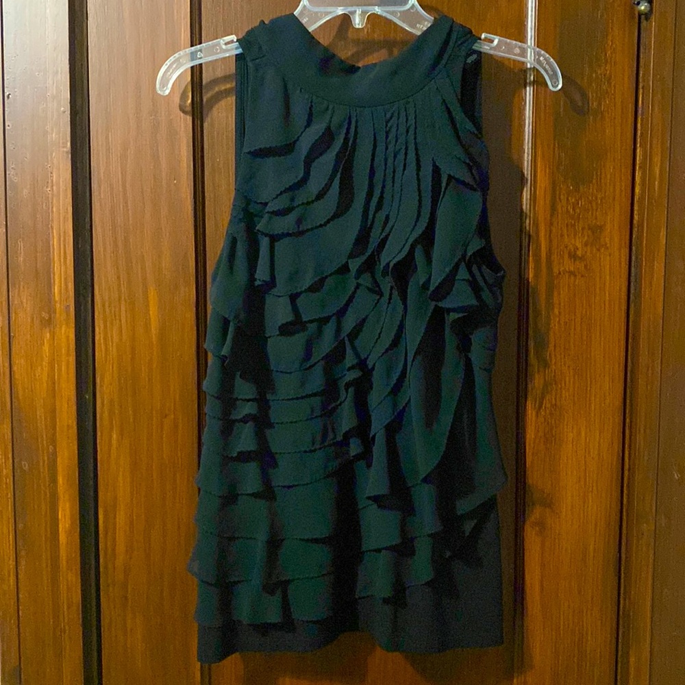 Ruffled sleeveless tie neck blouse